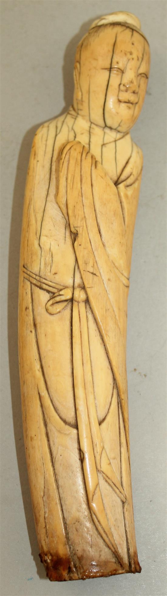 A Chinese ivory figure of a sage, late Ming dynasty, 20cm, age cracks, with stand